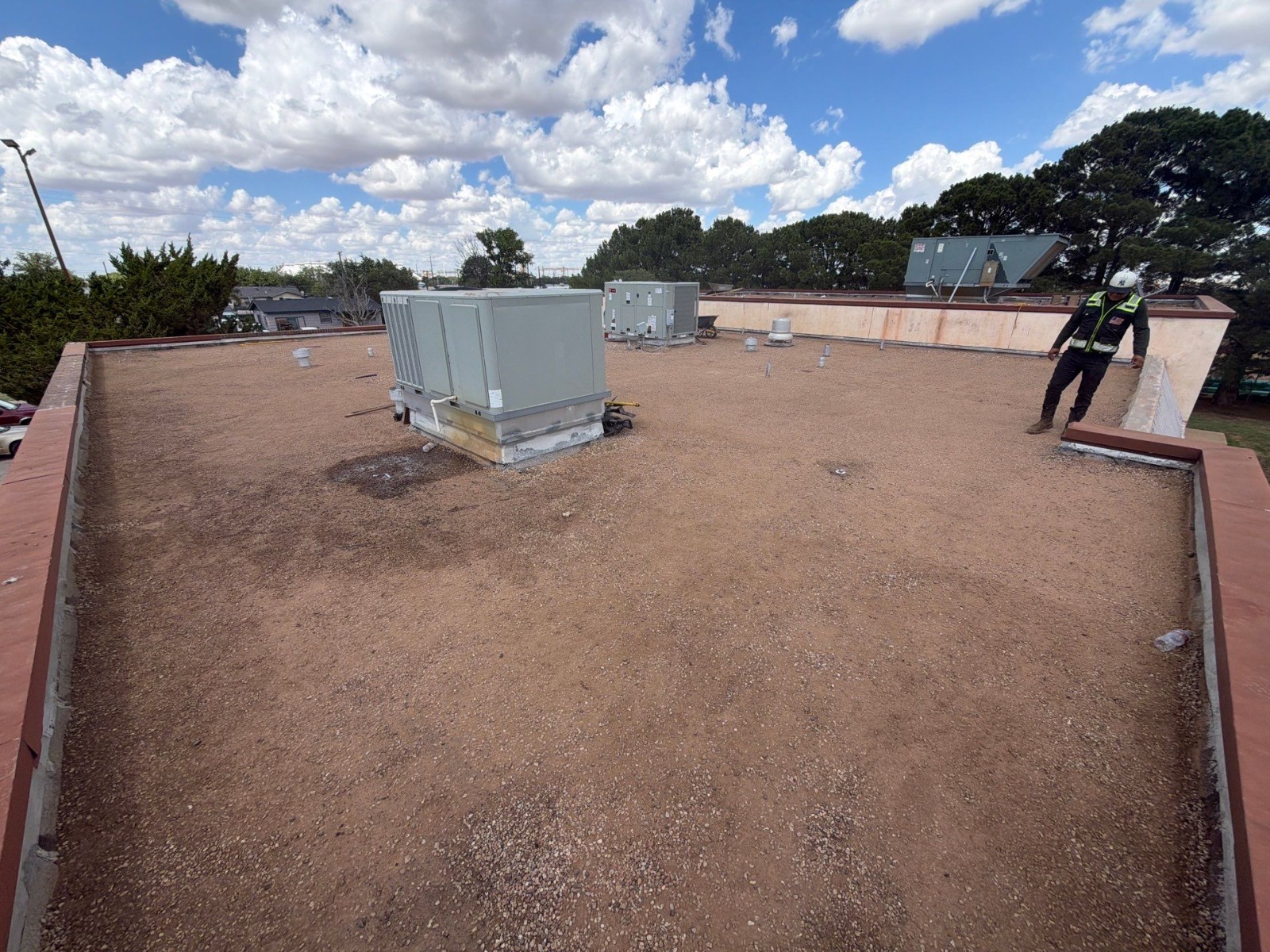 Gravel-surfaced built-up roof section with rooftop equipment at the senior center