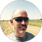 Johnny Widener with sunglasses in field
